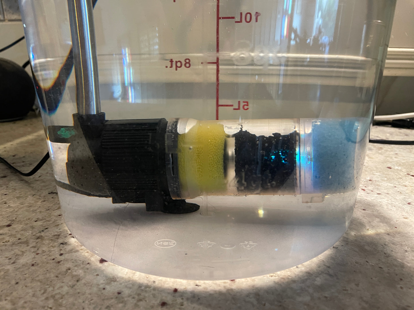 see through pump housing showing filters and uvc light